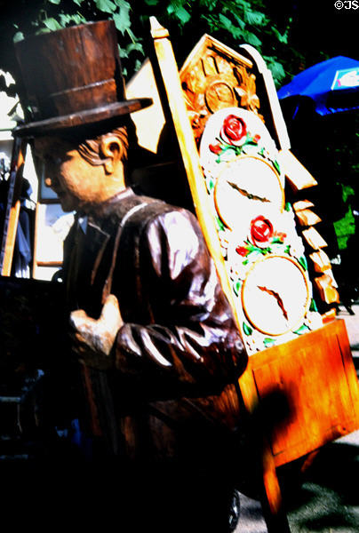 Carving of clock seller with backpack in Schwangau. Füssen, Germany.