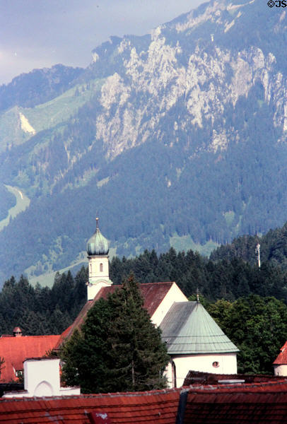 Alps over Franciscan Monastery Church. Füssen, Germany.