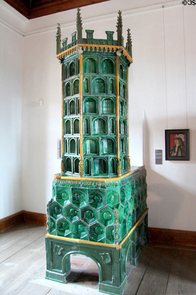 Ornate ceramic tiled heating stove in State Gallery at Hohes Schloss zu Füssen. Füssen, Germany.