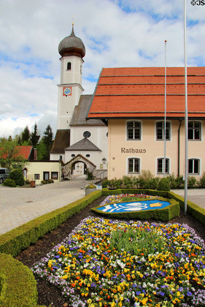 Gmund am Tegernsee town hall (Rathaus) with parish church, St Aegidius, in background. Gmund am Tegernsee, Germany.