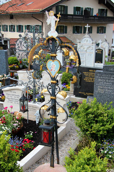 Ornate wrought iron grave marker in cemetery of St Aegidius parish church. Gmund am Tegernsee, Germany.