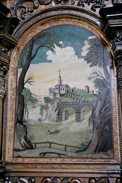 River scene wih church on hill painting adorning choir stall in St Lorenz Basilica. Kempten, Germany.