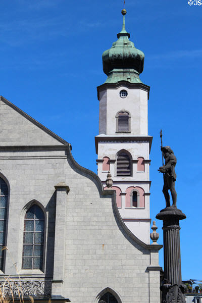 St Stephan's Church tower & statue of Neptune with trident & dolphin. Lindau im Bodensee, Germany.