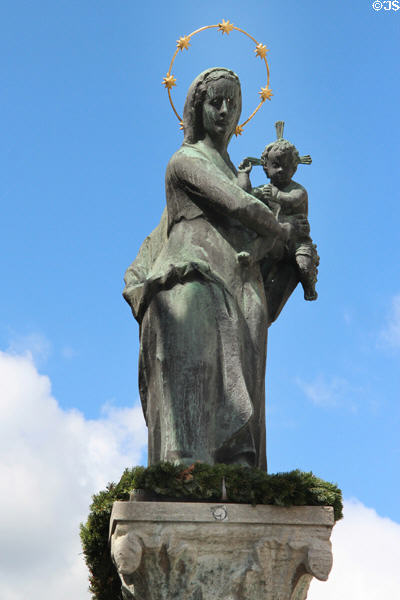 Market cross with Virgin & Child on Marktstraße. Bad Tölz, Germany.