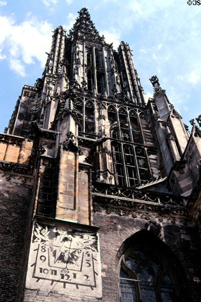 Brick exterior walls of Ulm Münster with sundial. Ulm, Germany.