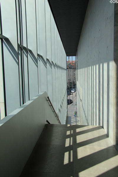 Corridor lit by large windows within Kunsthalle Weishaupt. Ulm, Germany.