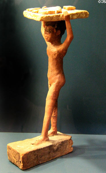 Egyptian carving (2ndC BCE) of bread carrier grave offering at Museum of Bread and Art. Ulm, Germany.