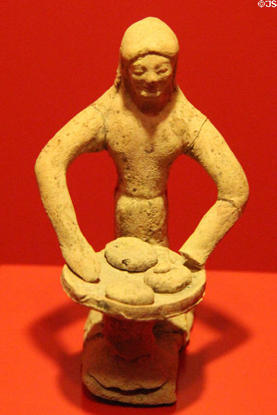 Greek terracotta sculpture of woman selling bread (5thC BCE) at Museum of Bread and Art. Ulm, Germany.
