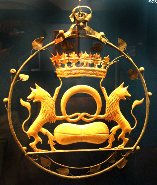 Copper bakery sign (18thC) with two foxes holding pretzel & bread in Donauwörth at Museum of Bread and Art. Ulm, Germany.