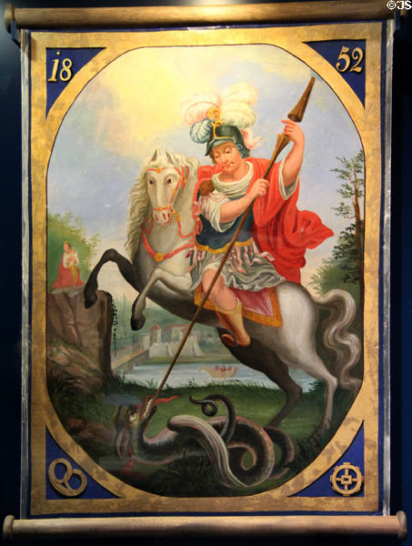 Procession flag of bakers & millers guild (1852) with painted image of St George slaying dragon at Museum of Bread and Art. Ulm, Germany.