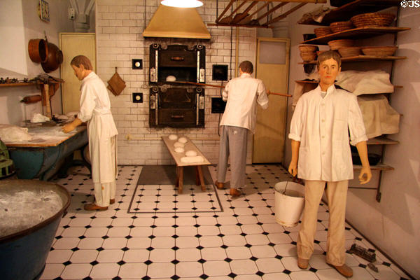 Model bakery working area (c1910) including working table & ovens at Museum of Bread and Art. Ulm, Germany.