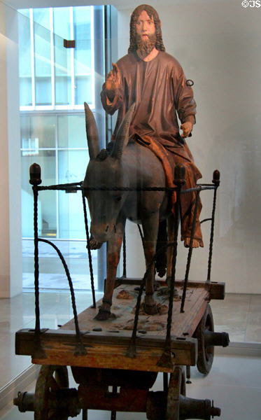 Procession cart carving (1464) by Hans Multscher workshop depicting Christ on his donkey as he enters Jerusalem at Ulmer Museum. Ulm, Germany.