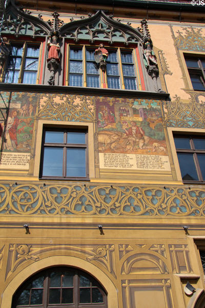 Local scenes of yesteryear painted on Ulm Rathaus. Ulm, Germany.