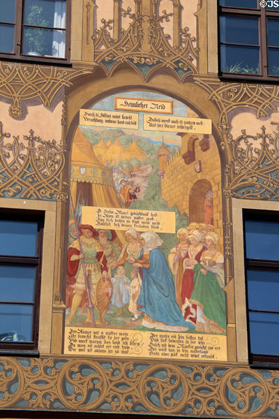 Scene depicting family & friendship on Ulm Rathaus. Ulm, Germany.