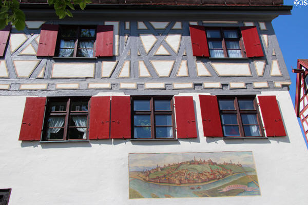 Half timbered buiding near Blau River with mural of historic 1717 siege when Belgrade was taken back from the Ottomans by Austria. Ulm, Germany.