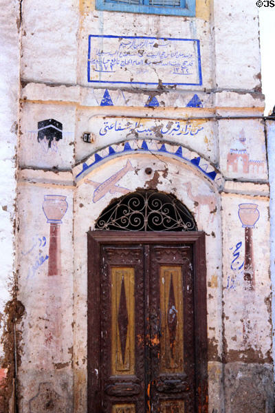 House decorated with scenes of Haj journey to Mecca in Esna. Egypt.