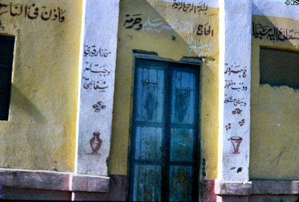 House with Arabic inscriptions on road between Luxor & Aswan. Egypt.