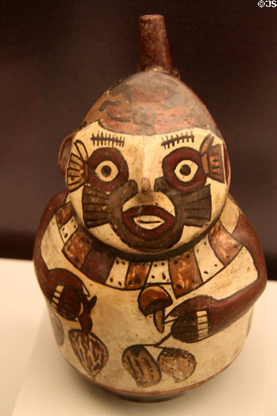 Nazca culture ceramic stirrup-spout bottle showing carrier of goods (100-700) from Peru at Museum of America. Madrid, Spain.