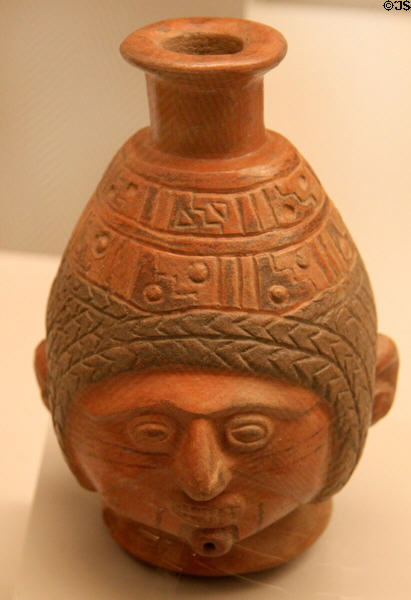 Inca ceramic bottle with human face (1400-1533) from Peru at Museum of America. Madrid, Spain.