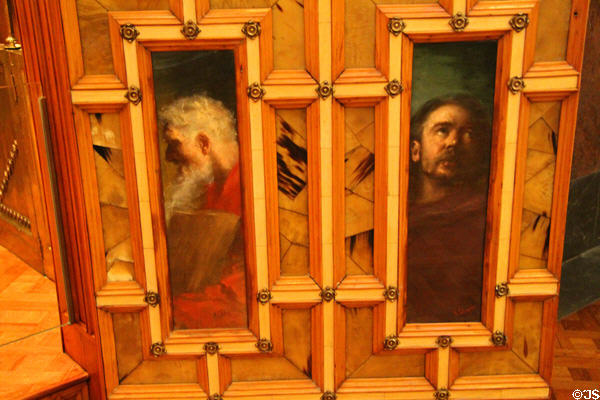 Saints painted on door of private chapel in central hall at Palau Güell. Barcelona, Spain.