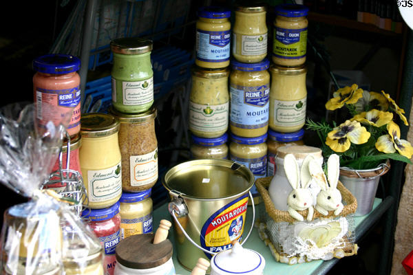 Array of Dijon mustards in shop window. Dijon, France.
