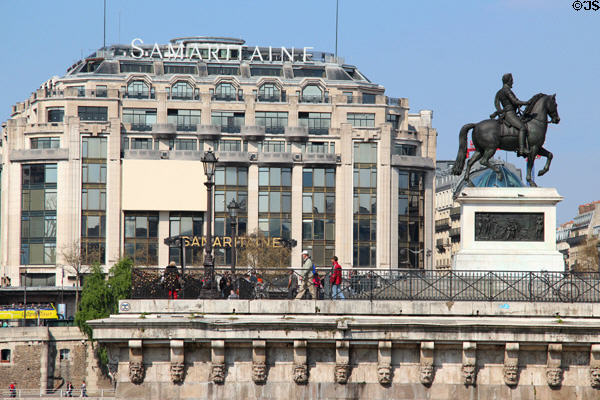 Samaritaine Department Store over equestrian statue of Henri IV at Pont Neuf. Paris, France.