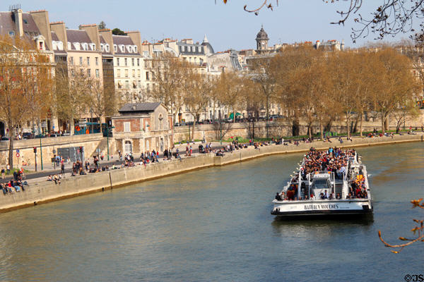 Seine riverfront buildings along Quai des Célestins opposite Île St Louis. Paris, France.