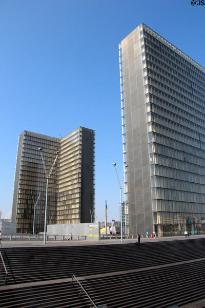 Two of four towers of National Library atop platform with steps up from Seine. Paris, France.