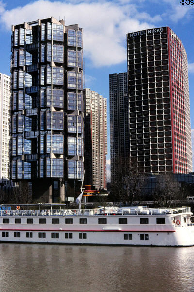 Tour Totem (1979) by Pierre Parat & Michel Andrault & red Hôtel Novotel Paris Tour Eiffel (1976) by Julien Penven & Jean Claude Le Bail both in Grenelle area. Paris, France.