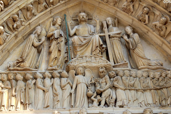 Last Judgment carving over center portal of Notre Dame Cathedral. Paris, France.