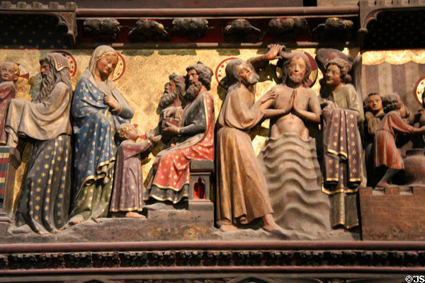 Baptism of Christ on carved stone chancel screen (14thC) in Notre Dame Cathedral. Paris, France.