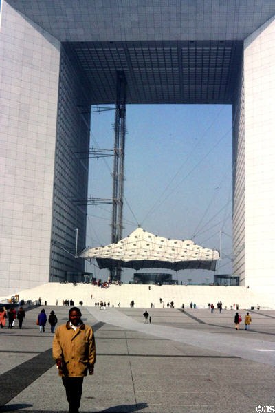 Walkers on plaza of La Grande Arche at La Défense. Paris, France.