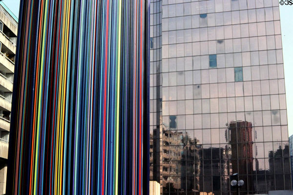 Le Moretti sculpture (1992) by Raymond Moretti with mirrored surface beyond at La Défense. Paris, France.