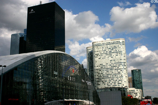 CNIT (1958) three-sided set of arches with other La Défense highrises beyond. Paris, France. Architect: Robert Camelot, Jean De Mailly & Bernard Zerhfuss.