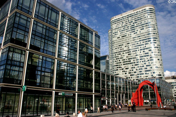 Black windows of Maison de La Défense (1983) hosts Red Spider sculpture (1974) by Alexander Calder. Paris, France. Architect: Henri La Fonta.
