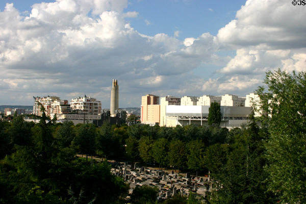 Cemetery of Neuilly with Courbevoie residential suburbs beyond seen from La Défense. Paris, France.