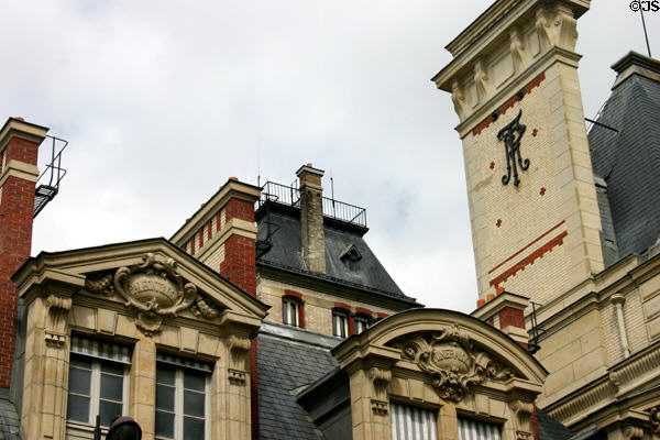 Chimney & pediments with scientific discipline plaques on rue St-Jacques at Sorbonne University. Paris, France.