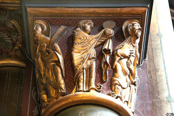Restored gilded saints on column capital at St-Germain-des-Prés. Paris, France.