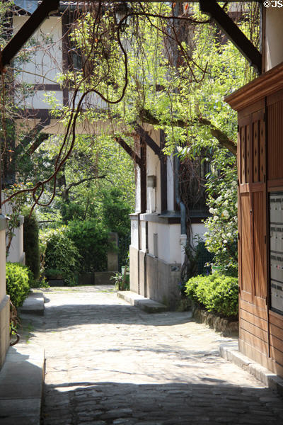 Cité Fleurie (1878-88) (65 Bd d'Arago) was built from materials of two International Expos & housed studios used by artists like Gauguin & Modigliani. Paris, France.