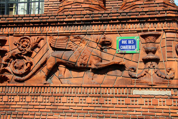 Frieze of winged griffin archeological motif at Institute of Art and Archeology. Paris, France.