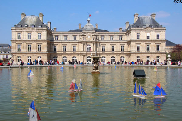 Luxembourg Palace over model sailboats on great basin of Luxembourg Gardens. Paris, France.