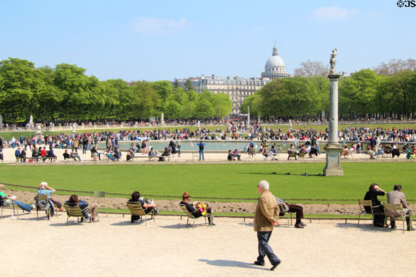 Parisians relaxing around ponds of Luxembourg Gardens. Paris, France.