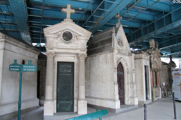 Roadway overpass bridge over tombs at Montmartre Cemetery. Paris, France.