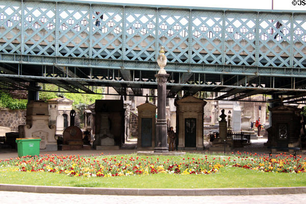 Roadway overpass bridge over tombs at Montmartre Cemetery. Paris, France.