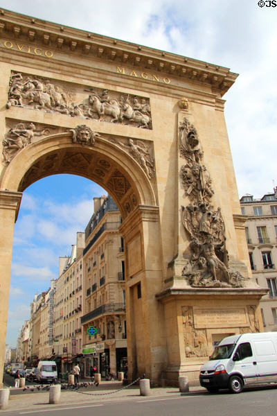 Roman victory symbols carved (1672) in Baroque style by François Giradon & Michel Anguier on Port St.-Denis commemorating Louis XIV's 1672Rhine Battles. Paris, France.