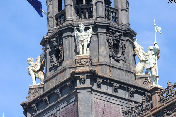 Female sphinxes encircle central tower of Paris City Hall. Paris, France.