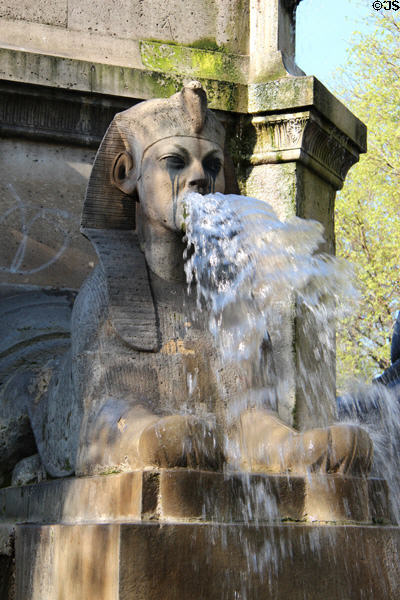 Sphinx spouting water from Fontaine du Palmier at Place du Châtelet. Paris, France.