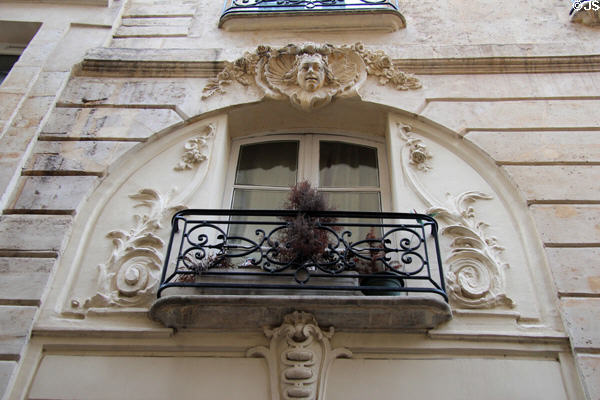 Window over doorway in old streets near Centre Pompidou. Paris, France.