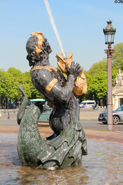River creature holding squirting fish detail of Fountain of Rivers (1840) by Jacques Ignace Hittorff in northern position on Place de la Concorde. Paris, France.
