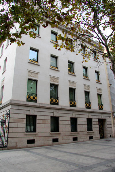 Building with golden railings on windows at 23 Champs Elysees revamped 2010. Paris, France.